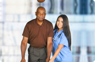 Health care worker helping an elderly patient